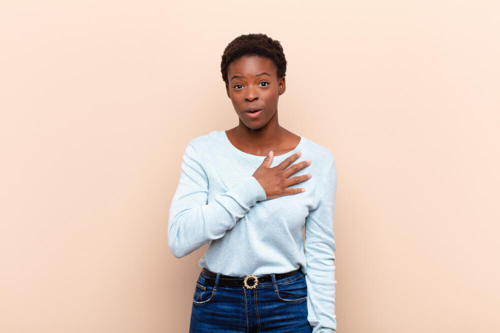 feeling-shocked-surprised-smiling-taking-hand-heart-happy-be-one-showing-gratitude (1)